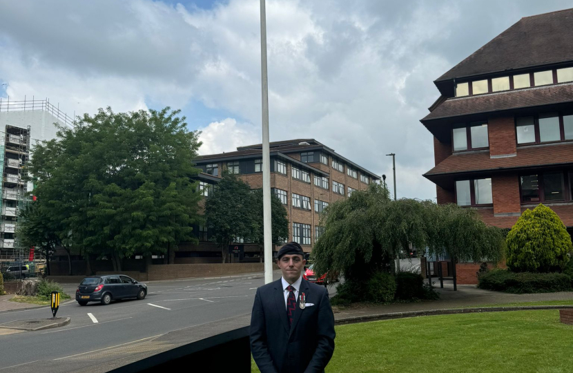 Pictured, the flag raising ceremony at Surrey Heath House