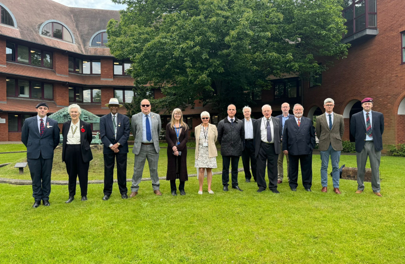 Pictured, the flag raising ceremony at Surrey Heath House