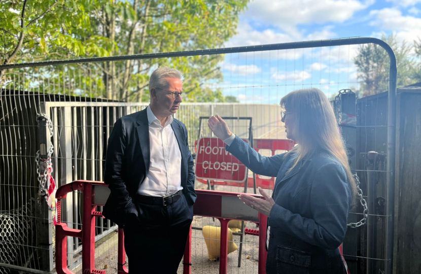 Pictured, Michael Gove MP with Councillor Valerie White at the footbridge