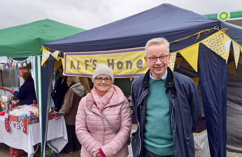 Pictured, Michael Gove with Christmas traders and Parish Cllr Katia Malcaus Cooper