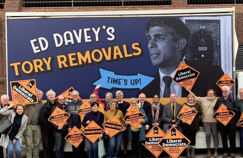 Pictured, Sir Ed Davey with the Lib Dem Parliamentary candidate for Surrey Heath, Alasdair Pinkerton