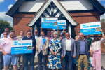 Pictured, Ed McGuinness, Theresa May, and Surrey Heath Conservative Association team members