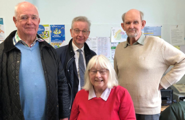 Pictured, Michael Gove MP with Cllr Richard Tear and volunteers at Bagshot Village Community Library