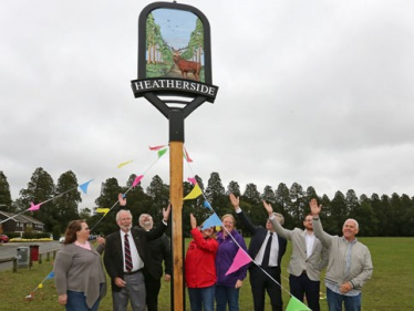 Pictured, the unveiling ceremony of the Community Pillar in Heatherside