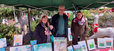 Pictured, Michael Gove with Christmas traders and Parish Cllr Katia Malcaus Cooper