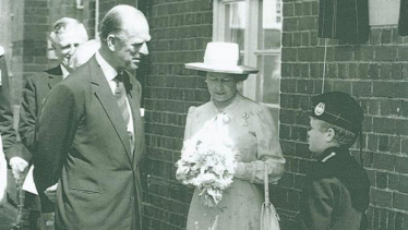 Queen Elizabeth II and the Duke of Edinburgh, Prince Philip, at Gordon School for Boys in West End