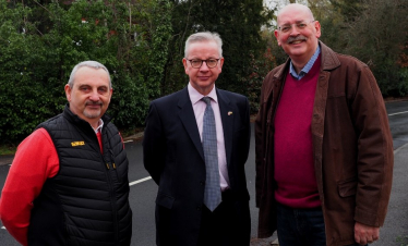 Pictured, Tony Henderson with Michael Gove MP and Cllr Alan McClafferty